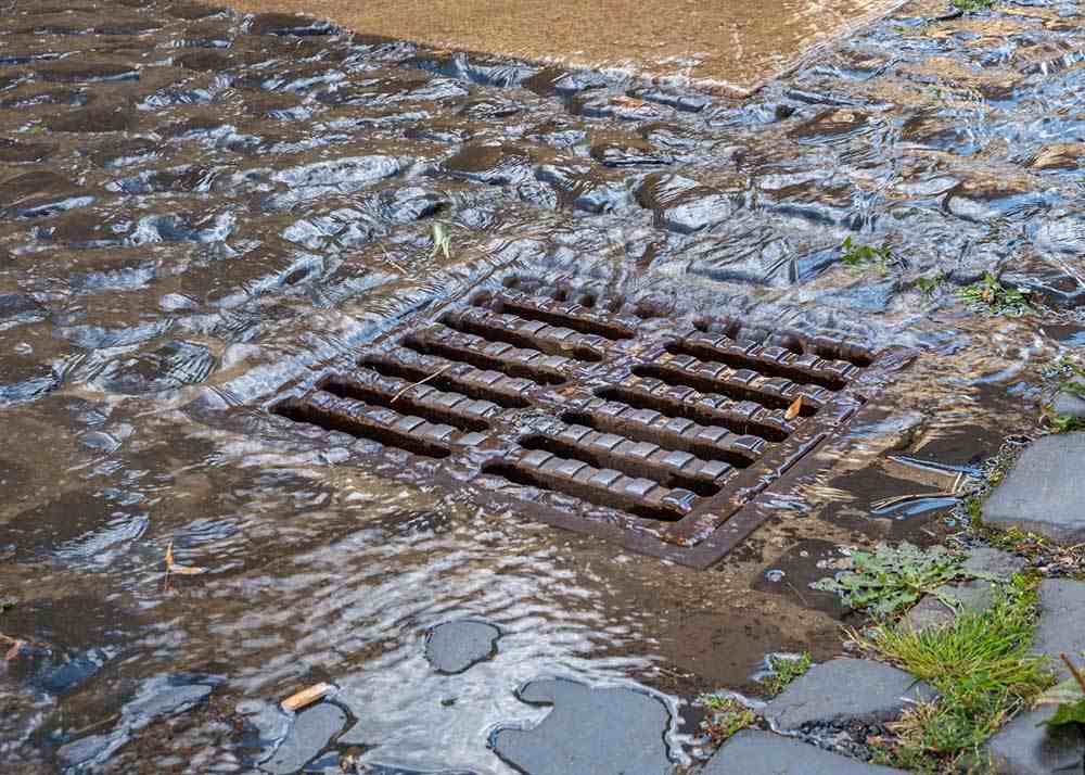 water flowing down a storm drain